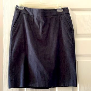 LOFT Navy pencil skirt. Size 4 petite. Never worn. Pockets. Slit in back